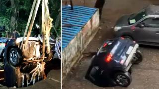 Дупка с вода в асфалта погълна цял автомобил в Индия (видео)